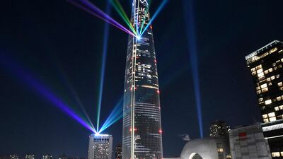 Beams of light are projected from the 123-storey Lotte World Tower during a countdown to the New Year in Seoul, South Korea. AFP