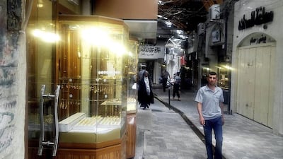 July 7, 2014: A man walking in the same market, nearly a month after ISIL militants took over the country’s second largest city. AP Photo