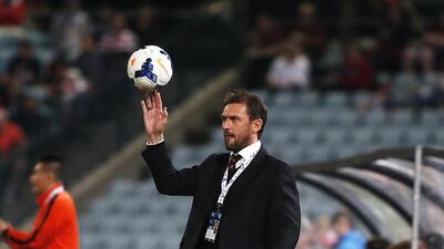 Western Sydney Wanderers coach Tony Popovic throws a ball during the Asian Champions League Group H match against China's Guizhou Renhe in Sydney on April 22, 2014. Daniel Munoz / AFP