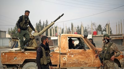 The Turkish-backed Syrian National Army on patrol in the north-eastern Manbij region, in Aleppo province. Britain is hoping to bring a peace deal to the force and opposition Kurdish SDF troops. AFP