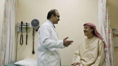 Abrar Khan, MD, speaks to Abdul Rahman al Khatib, a 56-year-old kidney transplant recipient at Sheikh Khalifa Medical City.