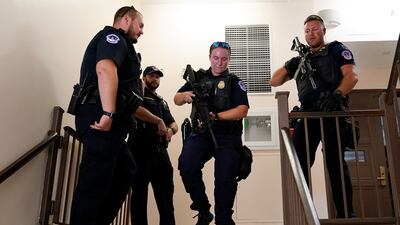 US Capitol Police officers clear a stairwell in the Dirksen Senate Office Building on Capitol Hill in Washington on Wednesday. AP