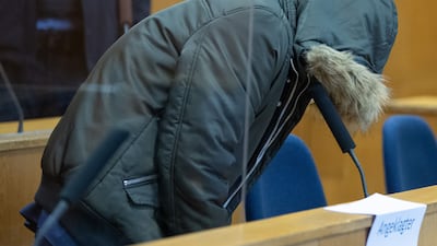 Syrian doctor Alaa Mousa, accused of crimes against humanity, arrives on January 19, 2022 for trial at a court in Frankfurt. AFP