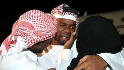 A tearful Mohammed Khamis Majed is greeted by his family as he arrives home last night after a 50-day kidnap ordeal in Nigeria.