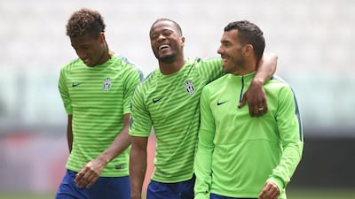 Juventus' players Patrice Evra, centre, Carlos Tevez, right and Kingsley Coman, left, shown during Monday's training session ahead of the Champions League final. Marco Bertorello / AFP
