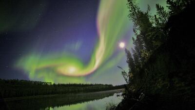 Swirls of green and red appear in an aurora over Whitehorse, Yukon in this Nasa handout image. David Cartier, senior/ Reuters /Nasa / Handout