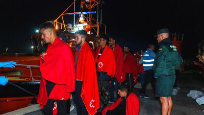 Migrants arrive at the port in Motril, southern Spain, after being rescued at sea by Spanish authorities. EPA