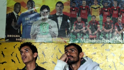 Yemenis watch a broadcast of the 2019 AFC Asian Cup group D soccer match between Yemen and Iraq, in Sanaa, Yemen, 12 January 2019. EPA