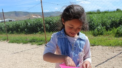 A pupil receives her weekly homework in Bekaa Valley, Lebanon. Hands Up supports a school in Lebanon’s Bekaa Valley for 300 Syrian refugee children.Courtesy Hands Up Foundation