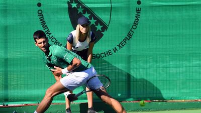 Serbian tennis player Novak Djokovic returns the ball during an exhibition match. AFP