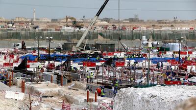Foreign labourers work at the construction site of the Al-Wakrah football stadium, one of the Qatar's 2022 World Cup stadiums, in Doha's Al-Wakrah southern suburbs. AFP