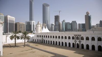 The World Trade Center Residences and Offices are seen behind the Al Hosn fort in Abu Dhabi. Silvia Razgova / The National