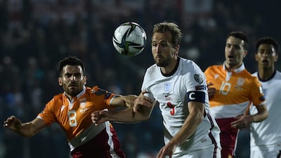 England forward Harry Kane and San Marino's midfielder Enrico Golinucci go for the ball. AFP