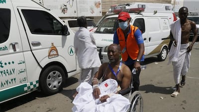 A rescue worker attends to a man injured in the stampede. Two weeks ago 110 people died in Mecca’s Grand Mosque when a crane working on an expansion project collapsed during a storm and toppled off the roof into the main courtyard, crushing pilgrims underneath. AP Photo