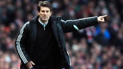 Swansea City's Danish manager Michael Laudrup gestures during the English Premier League football match between Arsenal and Swansea City at the Emirates Stadium in north London on December 1, 2012. Swansea won 2-0. AFP PHOTO / OLLY GREENWOOD