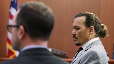 Depp returns from a break and stands for the jury. AFP