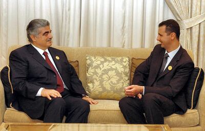 Lebanese prime minister Rafic Hariri, left, and former Syrian president Bashar Al Assad, pictured at a meeting in Beirut, had strained relations. AFP