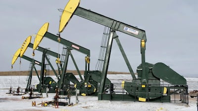 Pumpjacks taken out of production temporarily stand idle at a Hess site near Williston, North Dakota. Reuters