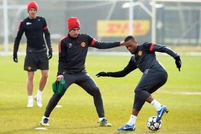 Robin van Persie said Manchester United players would push each other on in training. EPA