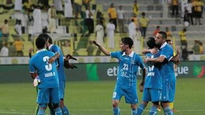 Adel Al Hammadi, centre, helps lead the celebration as his Dibba teammates react to their 3-2 win over host Al Wasl.