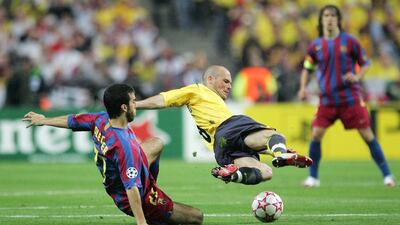Arsenal winger Fredrik Ljungberg is challenged by Presas Oleguer. Getty
