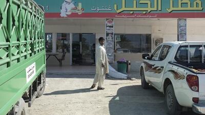 A Pakistani man stops to rest at the roadside cafe between the Ghantoot and Truck Road intersections on E11 Dubai-bound highway. Antonie Robertson/The National