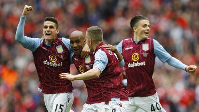 Fabian Delph celebrates with teammates after scoring the second goal for Aston Villa against Liverpool on Sunday. Darren Staples / Reuters