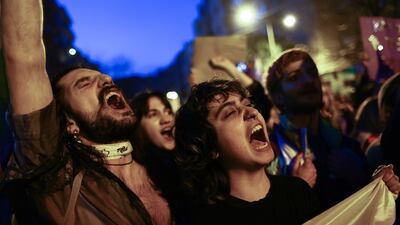 Protesters shout slogans during a rally. EPA