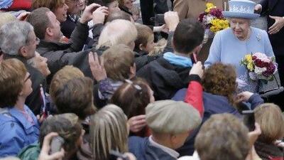 Britain's Queen Elizabeth II meets the public after a service in Enniskillen, Northern Ireland, in memory of 11 people who died in an 1987 IRA bombing.