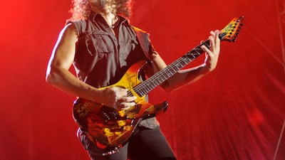 ADDS BYLINE Metallica's Kirk Hammett performs on Abu Dhabi's Yas Island late on October 25, 2011, as part of the group's World Magnetic tour concert . AFP PHOTO /ODAI AFANEH / AFP PHOTO / Odai Afaneh