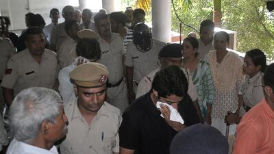 Indian police escort two men accused of gang raping a 21-year-old woman to their appearance at a court in Rohtak on July 20, 2016. AFP Photo