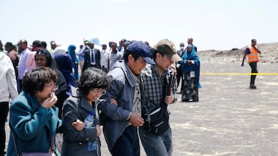 Members of a Chinese family mourn their son who died in the Ethiopian Airlines Flight ET 302 plane crash after a commemoration ceremony at the scene of the crash. Reuters