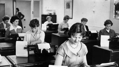 Women work at a typing pool in the 1950s. Getty Images