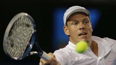 Tomas Berdych of the Czech Republic hits a forehand return to Serbia's Novak Djokovic during their quarter-final match at the Australian Open on January 22, 2013. Aaron Favila / AP Photo