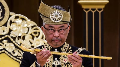 King Abdullah , holding a keris, a traditional Malay dagger, on the throne during his coronation at the National Palace in Kuala Lumpur. EPA