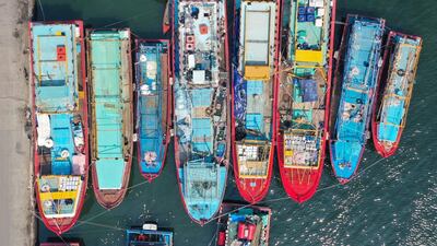 A picture taken with a drone shows fishing boats park at Muara Baru fishing port in Jakarta, Indonesia. EPA