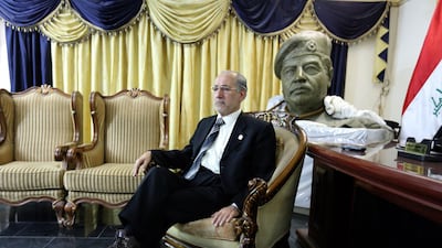Iraq’s former national security adviser Mowaffak Al Rubaie at home with a bust of Saddam and the rope used to hang him. AFP