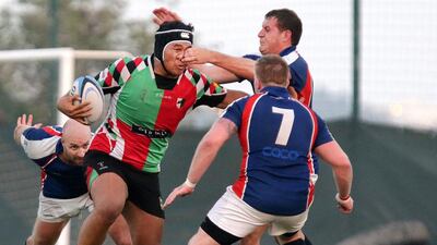 Abu Dhabi Harlequins, in red and green, facing Jebel Ali Dragons in the Gulf Top Six at the Jebel Ali Centre of Excellence on February 21, 2014. Jaime Puebla / The National