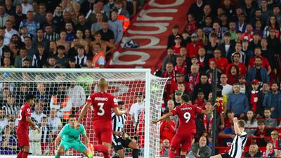 Roberto Firmino scores for Liverpool. Getty