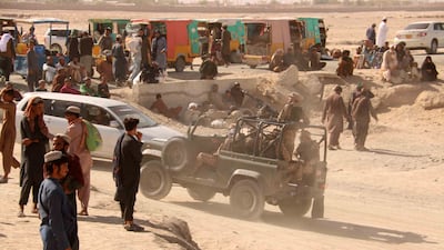 People stranded at a crossing on the Pakistan-Afghanistan border near Spin Boldak wait for it to reopen after it was closed by the Taliban. EPA