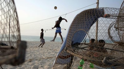 Indian fisherman play beach volleyball with a home made net on Jumeirah beach in the afternoon of the first day of Ramadan in Dubai. July 20, 2012. Antonie Robertson / The National