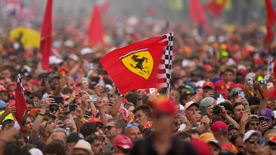 Ferrari supporters celebrate Ferrari driver Charles Leclerc's victory at the Italian Grand Prix. AP