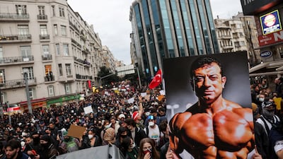 A banner depicts former Istanbul mayor Ekrem Imamoglu as supporters gather to protest against his arrest as part of a corruption investigation. Reuters