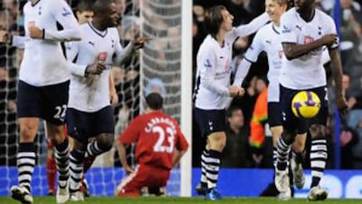 Tottenham players celebrate after Liverpool's Jamie Carragher's own goal levelled the scores at White Hart Lane before Spurs went on to win 2-1.