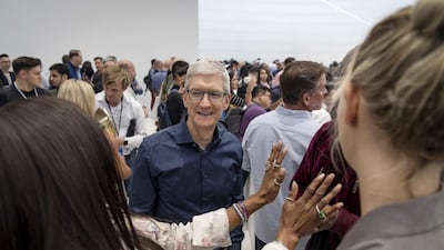Tim Cook mingles with attendees. David Paul Morris / Bloomberg