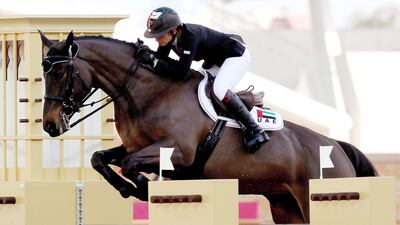 Sheikha Latifa bint Ahmed of the UAE, on-board Peanuts De Beaufour during the equestrian team final at the Arab Games in Doha, on December 20, 2011. Marwan Namaani / AFP
