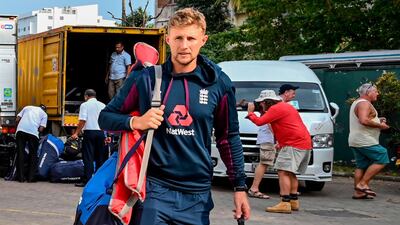 England captain Joe Root walks to the bus after the Test series against Sri Lanka was postponed. AFP