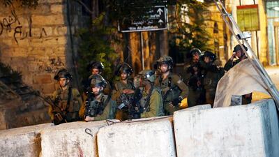 Israeli troops clash with Palestinian protesters in the city centre of Hebron in the West Bank. EPA