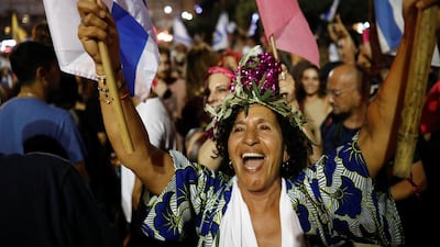People celebrate after Israel's parliament voted in a new coalition government, ending Benjamin Netanyahu's 12-year hold on power, at Rabin Square in Tel Aviv, Israel. Reuters