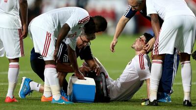 Mohnad Salem Ghazy Al Amin of the U.A.E. receives medical treatment during the international friendly between the UAE and Australia at Mohamed Bin Zayed Stadium on October 10, 2014 in Abu Dhabi, United Arab Emirates. Warren Little/Getty Images